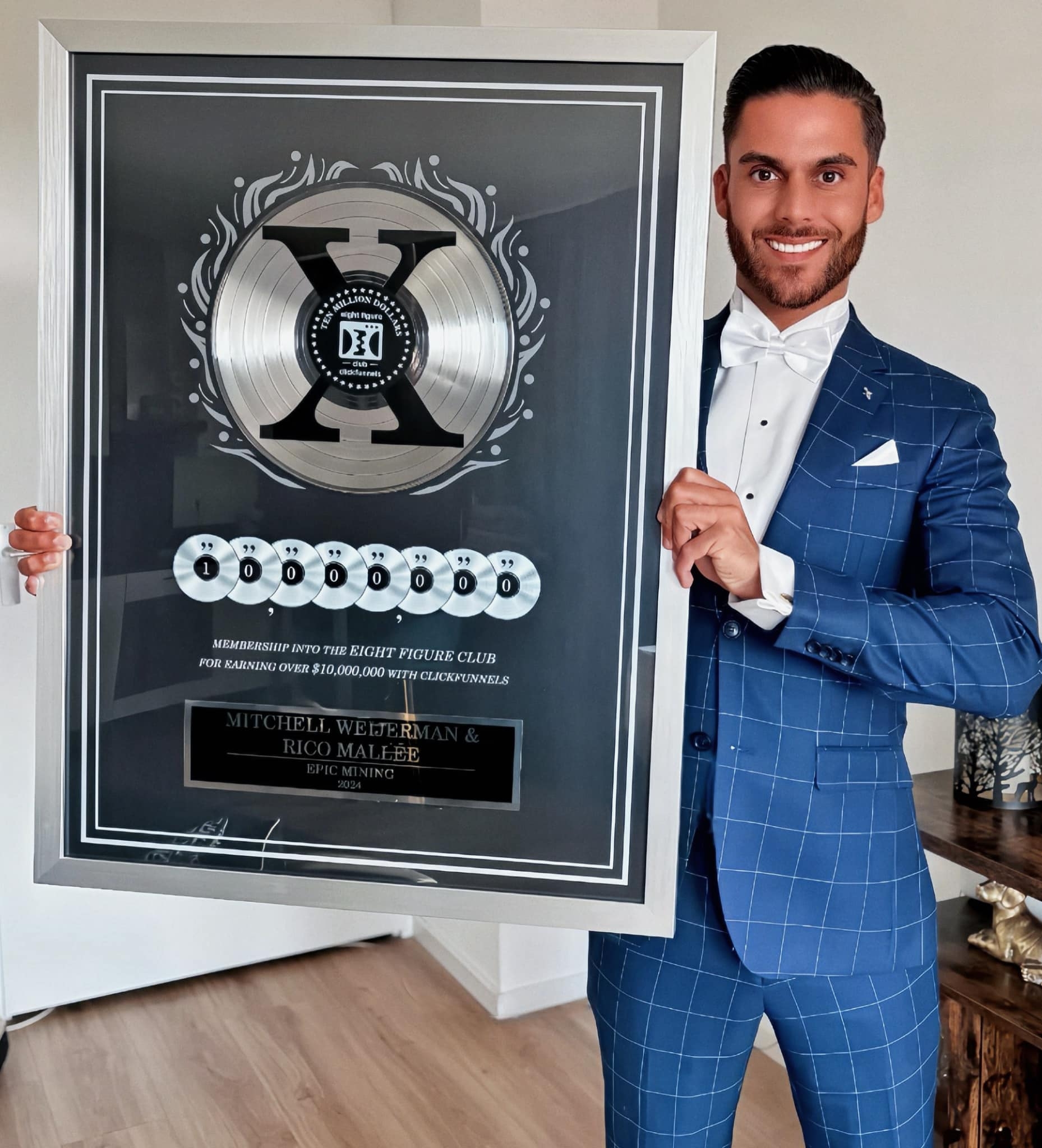 Rico Mallee with his ClickFunnels Eight Figure Club award for earning over $10,000,000